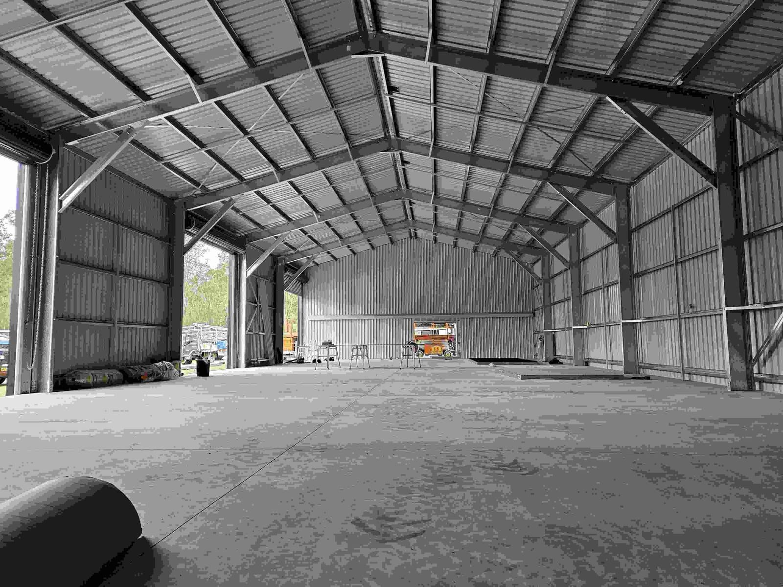 Clear-span interior of a large steel shed