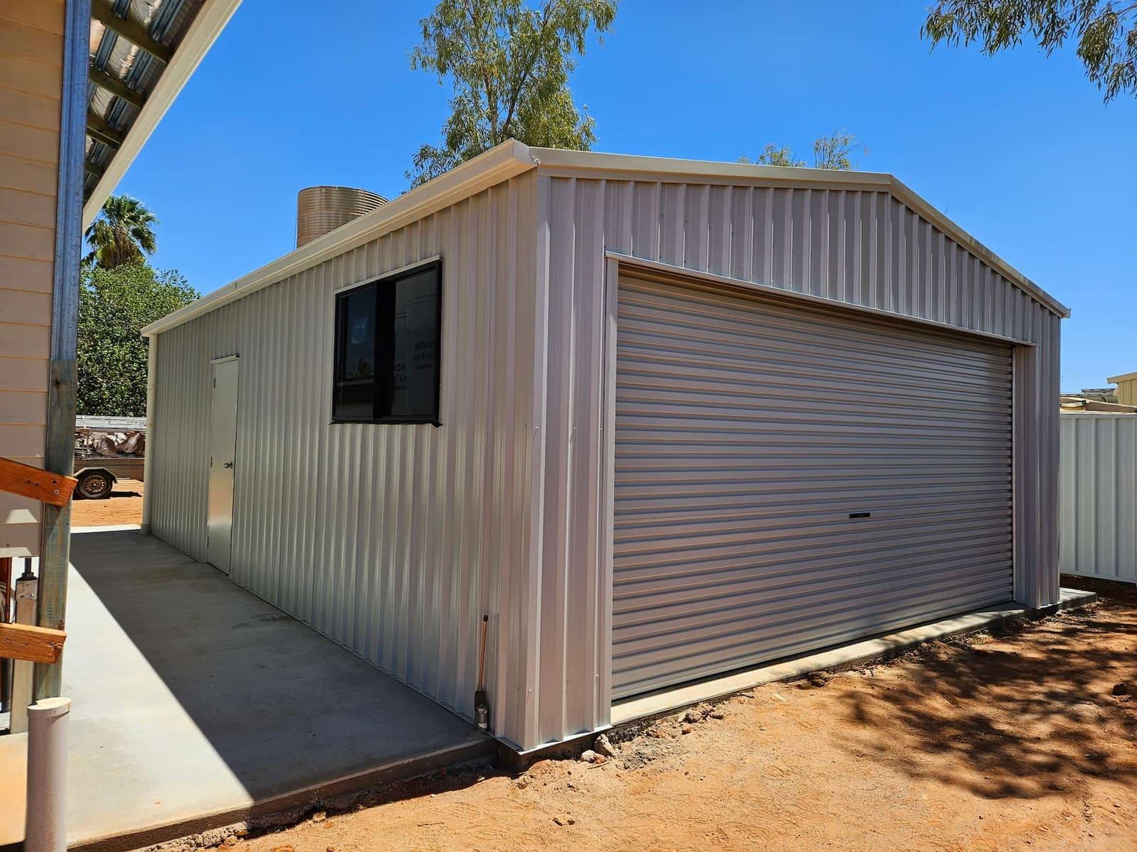 Beige steel garage with a window and roller door